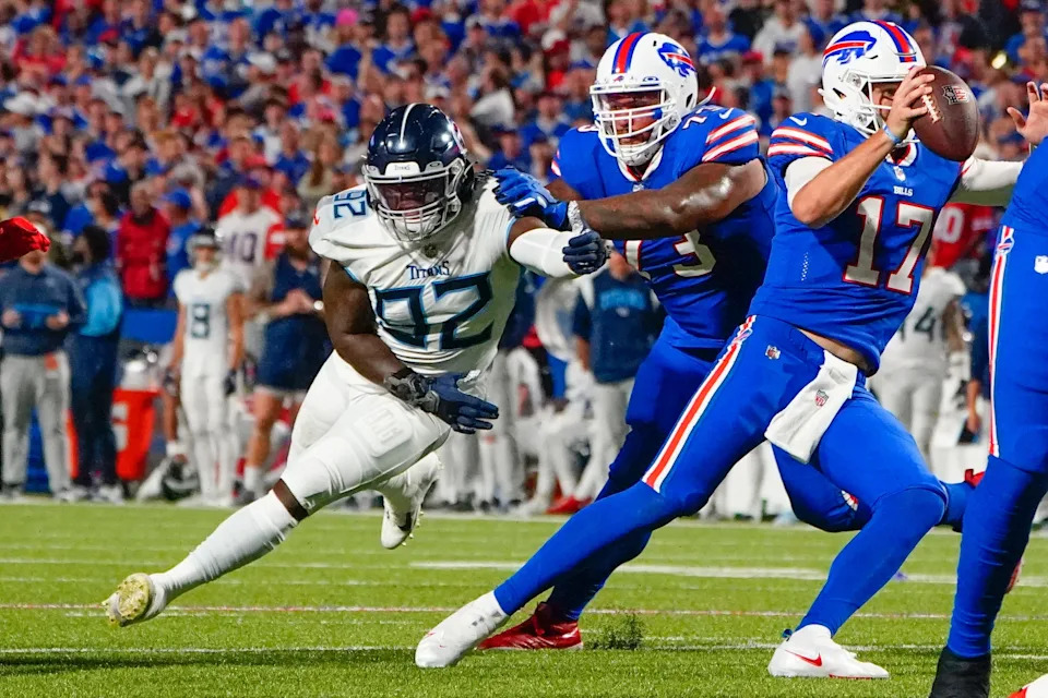 Sep 19, 2022; Orchard Park, New York, USA; Tennessee Titans linebacker Ola Adeniyi (92) rushes Buffalo Bills quarterback Josh Allen (17) with Buffalo Bills offensive tackle David Quessenberry (77) blocking during the first half at Highmark Stadium. Mandatory Credit: Gregory Fisher-USA TODAY Sports