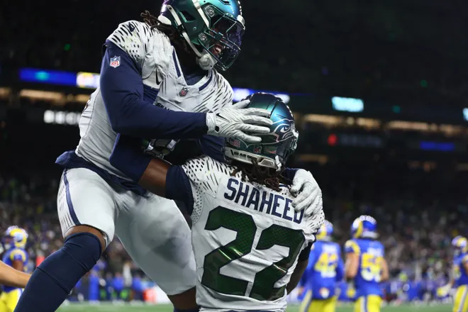 Dec 18, 2025; Seattle, Washington, USA; Seattle Seahawks wide receiver Rashid Shaheed (22) celebrates with fullback Brady Russell (38) after a touchdown against the Los Angeles Rams in the second half at Lumen Field. Mandatory Credit: Kevin Ng-Imagn Images