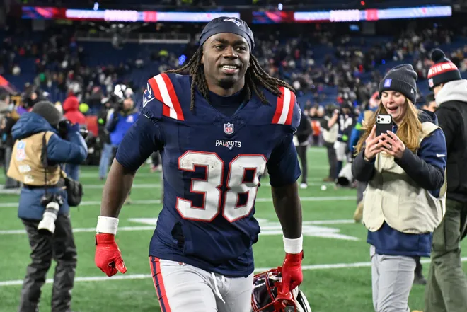 Jan 11, 2026; Foxborough, MA, USA; New England Patriots running back Rhamondre Stevenson (38) jogs off the field after defeating the Los Angeles Chargers in an AFC Wild Card Round game at Gillette Stadium. Mandatory Credit: Eric Canha-Imagn Images