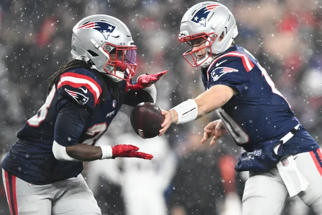 Jan 18, 2026; Foxborough, MA, USA; New England Patriots running back Rhamondre Stevenson (38) receives a hand off in the fourth quarter against the Houston Texans in an AFC Divisional Round game at Gillette Stadium. Mandatory Credit: Brian Fluharty-Imagn Images