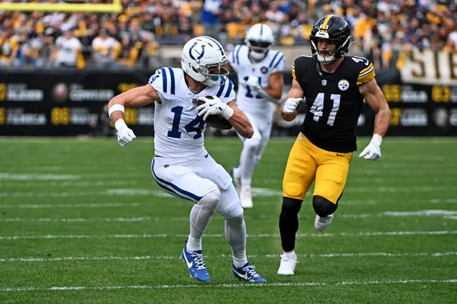 Nov 2, 2025; Pittsburgh, Pennsylvania, USA; Indianapolis Colts wide receiver Alec Pierce (14) catches a pass during the first half as Pittsburgh Steelers linebacker Payton Wilson (41) defends at Acrisure Stadium. Mandatory Credit: Barry Reeger-Imagn Images