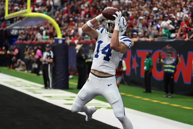 Jan 4, 2026; Houston, Texas, USA; Indianapolis Colts wide receiver Alec Pierce (14) catches a touchdown pass against the Houston Texans during the first half at NRG Stadium. Mandatory Credit: Thomas Shea-Imagn Images