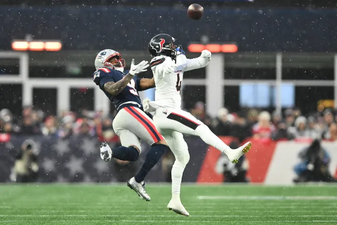 Houston Texans cornerback Kamari Lassiter (4) blocks a pass intended for New England Patriots wide receiver Kayshon Boutte