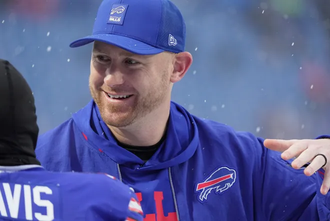Buffalo Bills offensive coordinator Joe Brady greets players as they take the field before their game against the Bengals at Highmark Stadium in Orchard Park on Dec. 7, 2025.