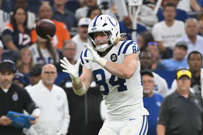 Sep 14, 2025; Indianapolis, Indiana, USA; Indianapolis Colts tight end Tyler Warren (84) makes a catch during the fourth quarter against the Denver Broncos at Lucas Oil Stadium. Mandatory Credit: Robert Goddin-Imagn Images