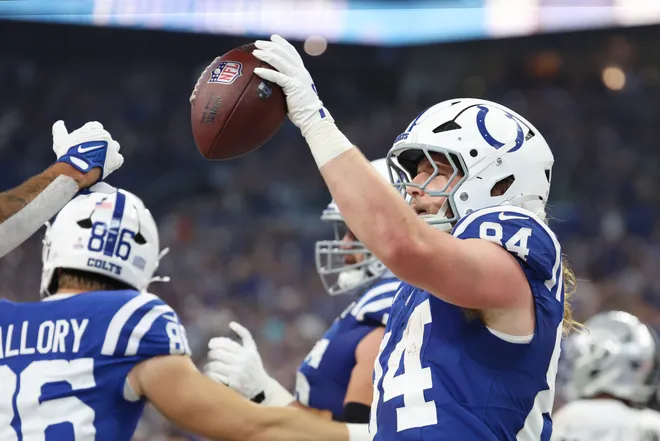 Oct 5, 2025; Indianapolis, Indiana, USA; Indianapolis Colts tight end Tyler Warren (84) celebrates after scoring a touchdown against the Las Vegas Raiders during the first quarter at Lucas Oil Stadium. Mandatory Credit: Trevor Ruszkowski-Imagn Images