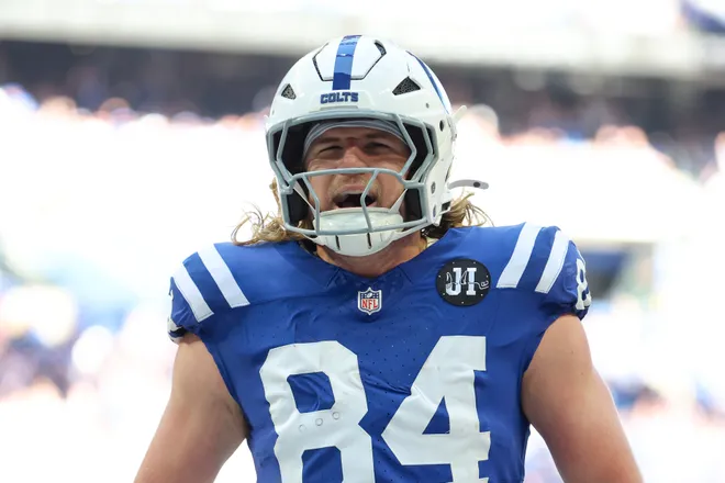 Oct 12, 2025; Indianapolis, Indiana, USA; Indianapolis Colts tight end Tyler Warren (84) celebrates after scoring a touchdown against the Arizona Cardinals during the first quarter of the game at Lucas Oil Stadium. Mandatory Credit: Trevor Ruszkowski-Imagn Images