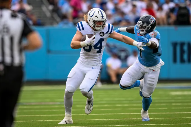 Sep 21, 2025; Nashville, Tennessee, USA; Indianapolis Colts tight end Tyler Warren (84) tuns the ball during the first quarter at Nissan Stadium. Mandatory Credit: Steve Roberts-Imagn Images