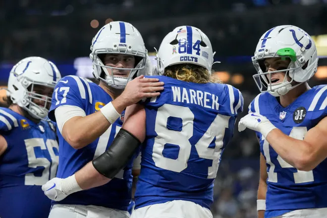Indianapolis Colts tight end Tyler Warren (84) celebrates with his teammates after scoring a touchdown Sunday, Nov. 30, 2025, during a game against the Houston Texans at Lucas Oil Stadium in Indianapolis.