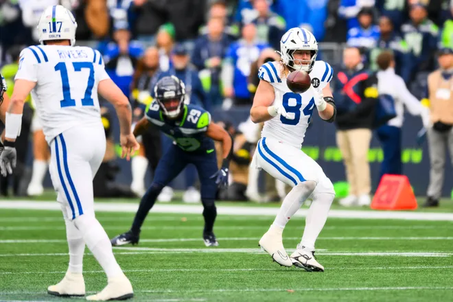 Dec 14, 2025; Seattle, Washington, USA; Indianapolis Colts tight end Tyler Warren (84) catches a pass against the Seattle Seahawks during the second quarter at Lumen Field. Mandatory Credit: Steven Bisig-Imagn Images