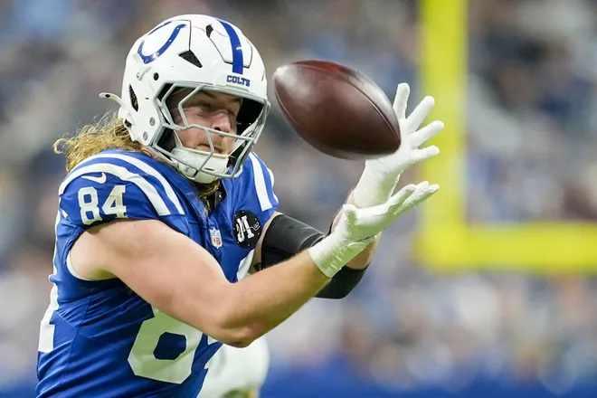 Indianapolis Colts tight end Tyler Warren (84) pulls in a catch for a first down Sunday, Dec. 28, 2025, during a game against the Jacksonville Jaguars at Lucas Oil Stadium in Indianapolis.