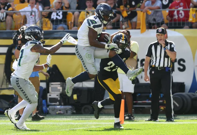 Seattle Seahawks running back Kenneth Walker III (9) leaps into the end zone to score a touchdown against the Pittsburgh Steelers during the fourth quarter.