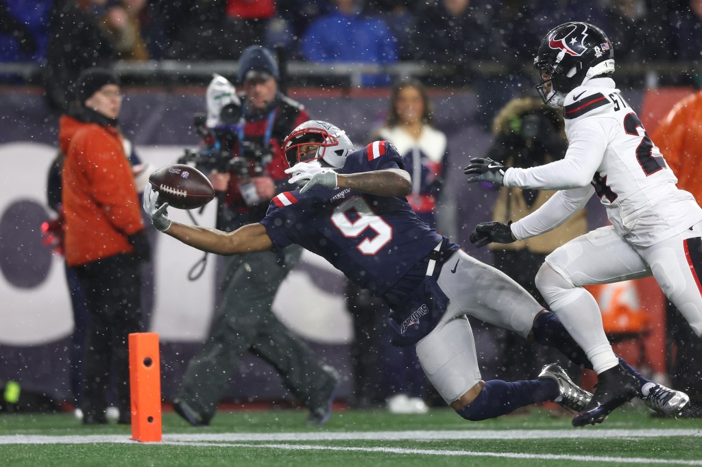 Kayshon Boutte of the New England Patriots catches a touchdown pass against the Houston Texans.