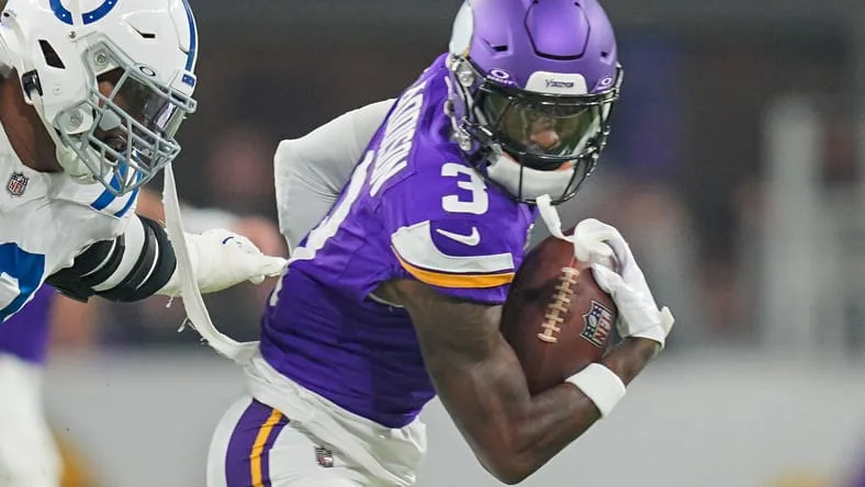 Vikings wide receiver Jordan Addison running upfield after a catch at U.S. Bank Stadium.