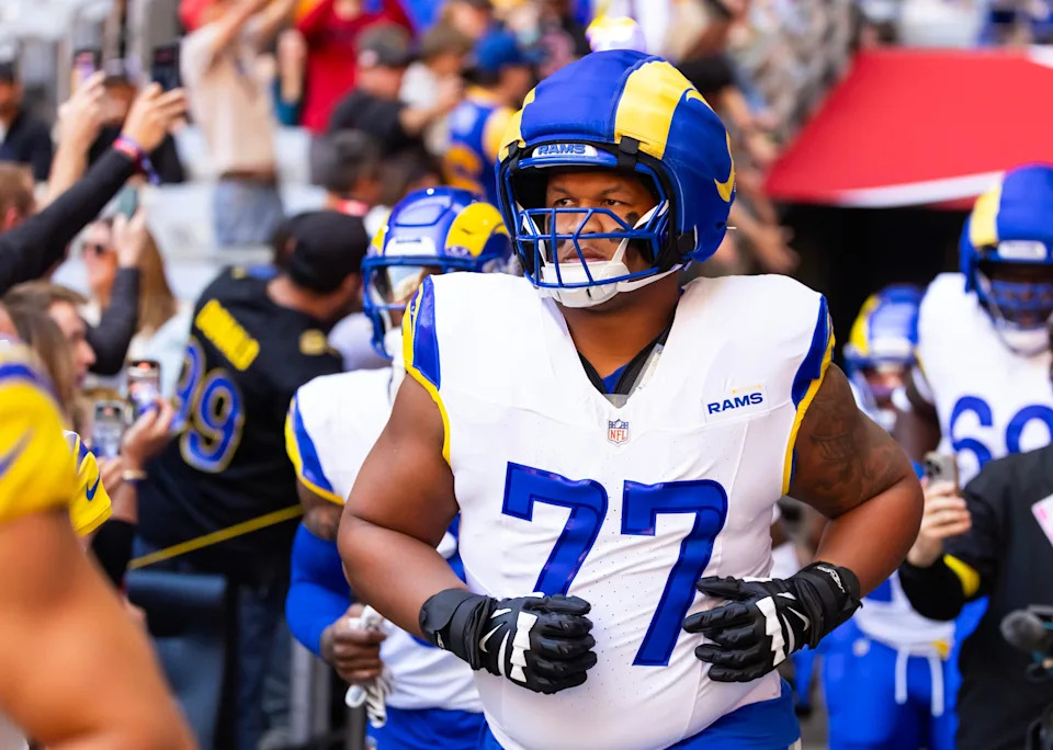 Dec 7, 2025; Glendale, Arizona, USA; Los Angeles Rams offensive lineman Alaric Jackson (77) against the Arizona Cardinals at State Farm Stadium. Mandatory Credit: Mark J. Rebilas-Imagn Images