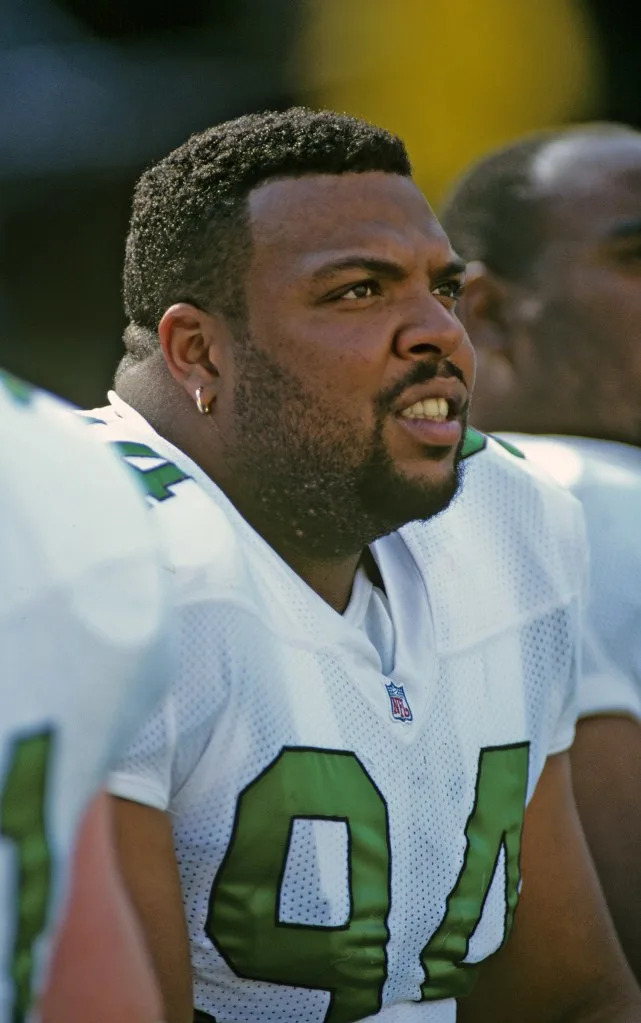 Defensive lineman Kevin Johnson #94 of the Philadelphia Eagles looks on from the sideline during a 1995 game. Getty Images