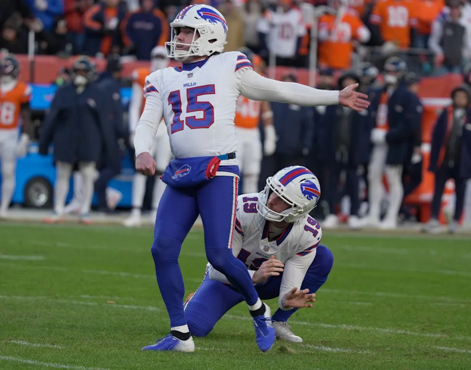 Buffalo Bills place kicker Matt Prater watches as the kick goes through the goal post during second half action at Empower Field at Mile High in Denver, Colorado on Jan. 17, 2026. Buffalo Bills punter Mitch Wishnowsky, who held the ball for Prater, also watches the trajectory of the ball.