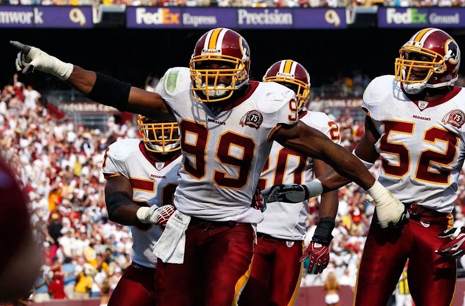LANDOVER, MD - OCTOBER 07: Washington Redskins defensive end Andre Carter #99 celebrates after sacking Detroit Lions quarterback Jon Kitna for a safety in third quarter action at FedEx Field October 7, 2007 in Landover, Maryland. The Redskins defeated the Lions by a score of 34-3. (Photo by Win McNamee/Getty Images)
