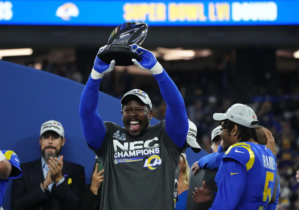 Los Angeles Rams linebacker Von Miller hoists the George Halas Trophy after defeating the San Francisco 49ers in the NFC championship game.