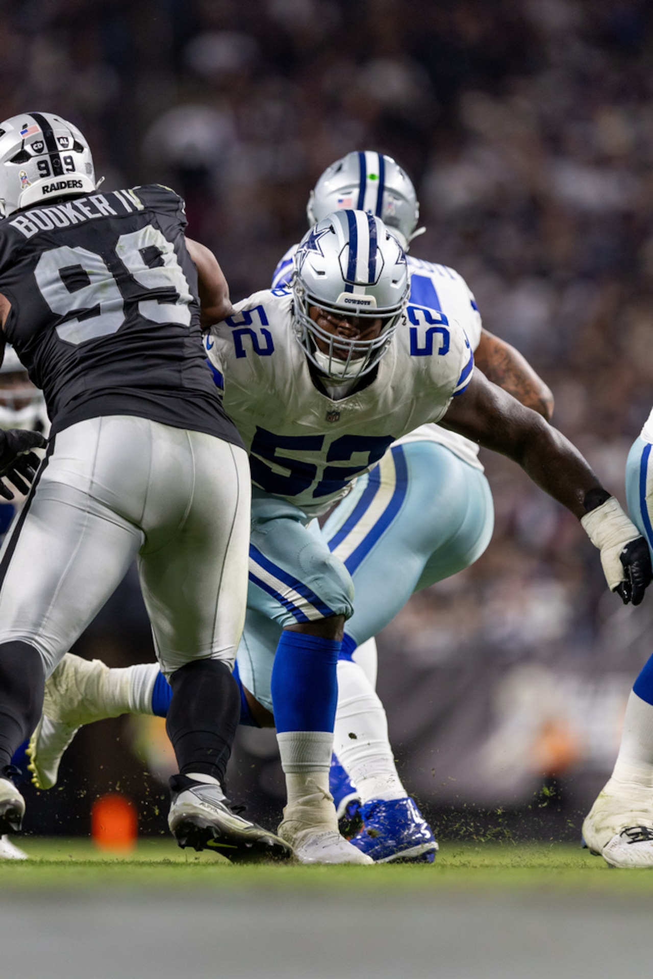 Dallas Cowboys guard Tyler Booker (52) blocks during an NFL game against the Las Vegas Raiders on Nov. 17, 2025, at Allegiant Stadium in Las Vegas.