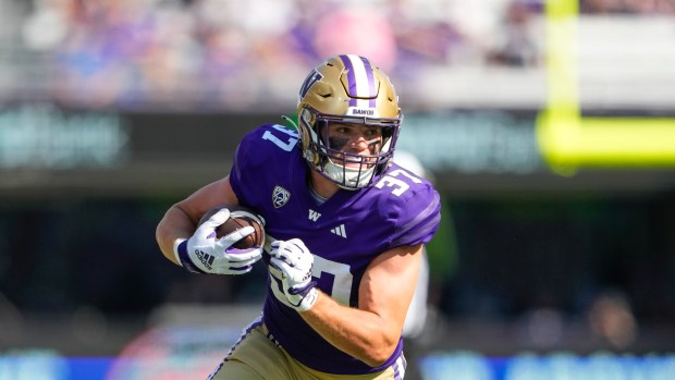 Washington tight end Jack Westover runs the ball against Boise State during the second half of an NCAA college football game, Saturday, Sept. 2, 2023, in Seattle. Washington won 56-19. (AP Photo/Lindsey Wasson)