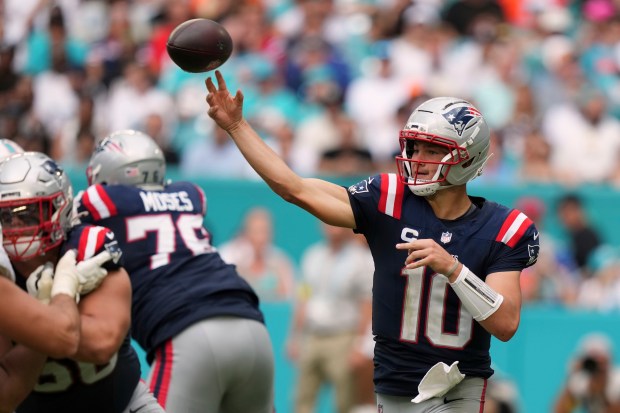 New England Patriots' Drake Maye throws during the second half of an NFL football game against the Miami Dolphins Sunday, Sept. 14, 2025, in Miami Gardens, Fla. (AP Photo/Lynne Sladky)