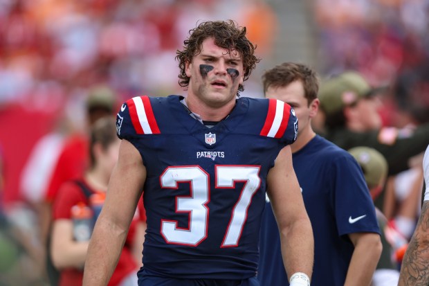 New England Patriots tight end Jack Westover (37) walks the sideline during an NFL football game against the Tampa Bay Buccaneers, Sunday, Nov. 9, 2025, in Tampa, Fla. Patriots defeated the Buccaneers 28-23. (AP Photo/Gary McCullough)