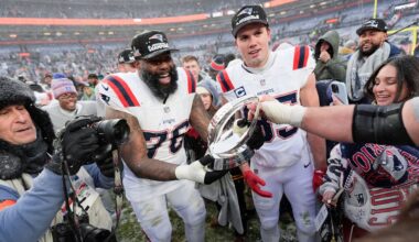 New England Patriots offensive tackle Morgan Moses (76) and tight end Hunter Henry celebrate after the AFC Championship NFL football game against the Denver Broncos, Sunday, Jan. 25, 2026, in Denver. (AP Photo/Ashley Landis)