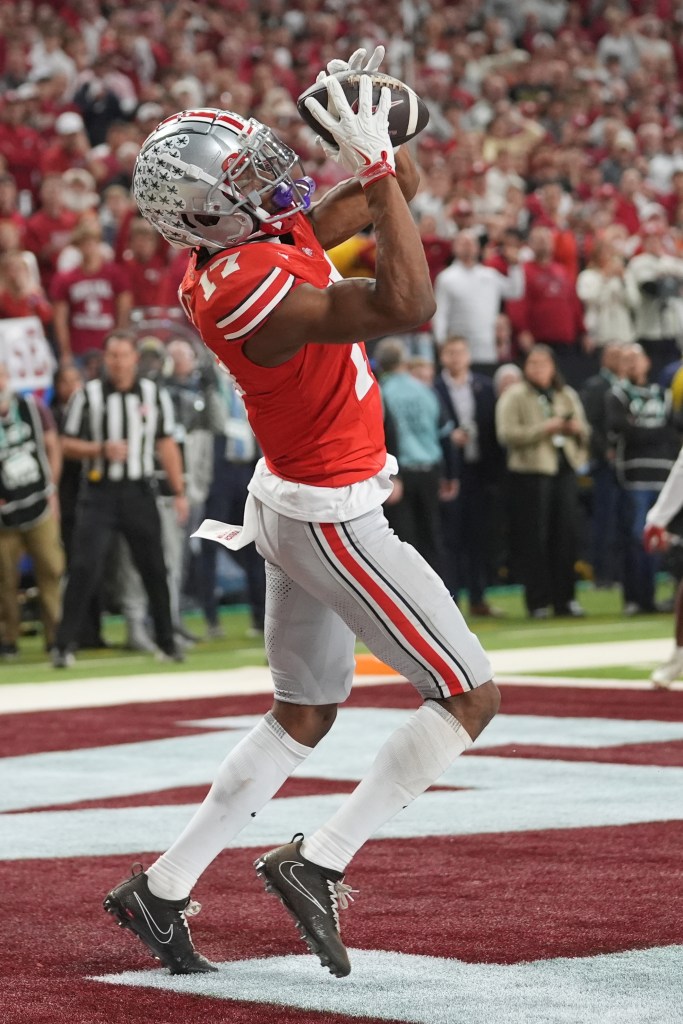 Ohio State's Carnell Tate catches a touchdown pass during the first half of the Big Ten championship NCAA college football game against Indiana in Indianapolis, Saturday, Dec. 6, 2025.
