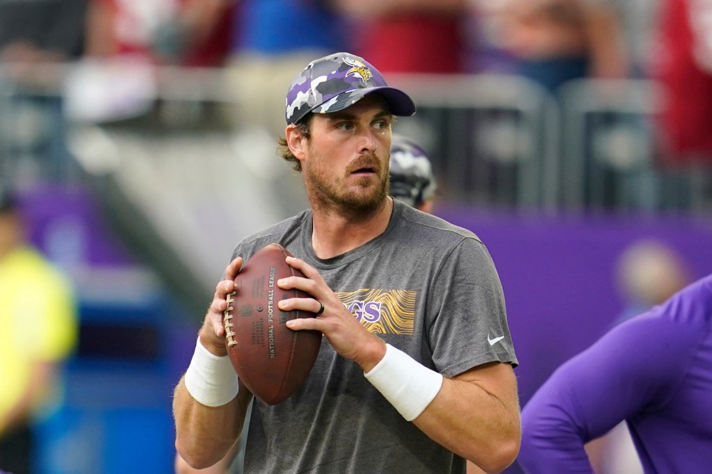 Minnesota Vikings quarterback Sean Mannion warms up before a preseason NFL football game against the San Francisco 49ers, Aug. 20, 2022, in Minneapolis. (