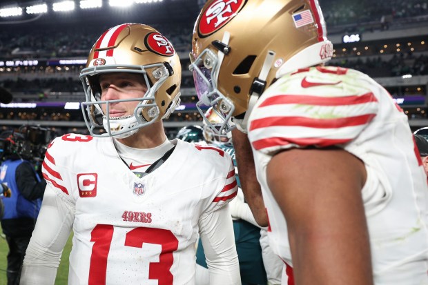 PHILADELPHIA, PENNSYLVANIA - JANUARY 11: Brock Purdy #13 and Jauan Jennings #15 of the San Francisco 49ers celebrate after their team's 23-19 win against the Philadelphia Eagles in the NFC Wild Card Playoff game at Lincoln Financial Field on January 11, 2026 in Philadelphia, Pennsylvania. (Photo by Elsa/Getty Images)