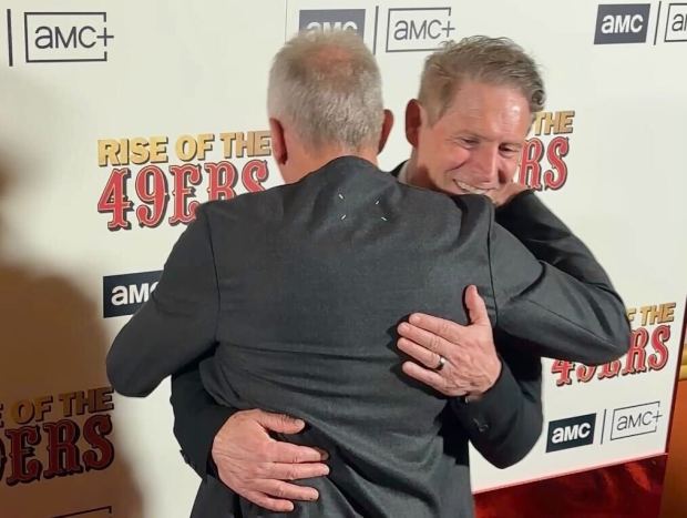 Steve Young and Joe Montana share a hug at the premiere of "Rise of the 49ers" at Alamo Drafthouse in San Francisco on Jan. 27, 2026. (Photo: Cam Inman/Bay Area News Group)