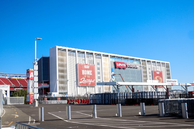 Workers put up a sign for the Super Bowl at Levi's Stadium in Santa Clara, Calif., on Wednesday, Jan. 14, 2026. (Shae Hammond/Bay Area News Group)