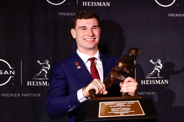 Heisman Trophy winner quarterback Fernando Mendoza of Indiana with The Heisman Memorial Trophy during a news conference at the Marriott Marquis Hotel on Saturday, Dec. 13, 2025, in New York. (Adam Hunger/Getty Images/TNS)