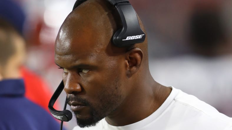 Brian Flores on the sideline coaching during a Patriots game. Peter Woods Vikings.