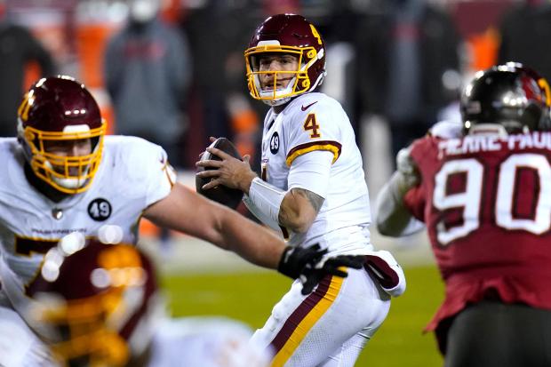 Washington quarterback Taylor Heinicke looks to pass against the Buccaneers during the second half of an NFC wild-card game Jan. 9, 2021, in Landover, Md. (AP Photo/Julio Cortez)