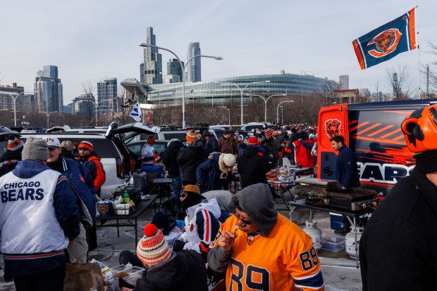 Fans tailgate before the Chicago Bears play the Detroit Lions at Soldier Field Sunday Jan. 4, 2026 in Chicago. (Armando L. Sanchez/Chicago Tribune)