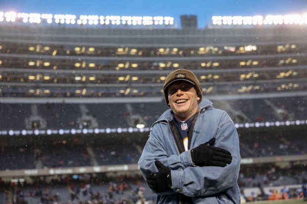 Cubs outfielder Pete Crow-Armstrong stays warm on the field before the Chicago Bears face the Los Angeles Rams on Jan. 18, 2026, in an NFC divisional playoff game at Soldier Field. (Brian Cassella/Chicago Tribune)