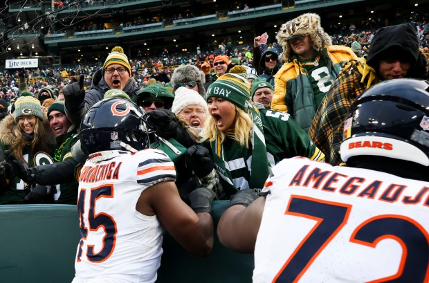 Packers fans yell at Bears linebacker Amen Ogbongbemiga (45) as he celebrates Cairo Santos' game-winning field goal Jan. 5, 2025, at Lambeau Field in Green Bay, Wis. (Eileen T. Meslar/Chicago Tribune)