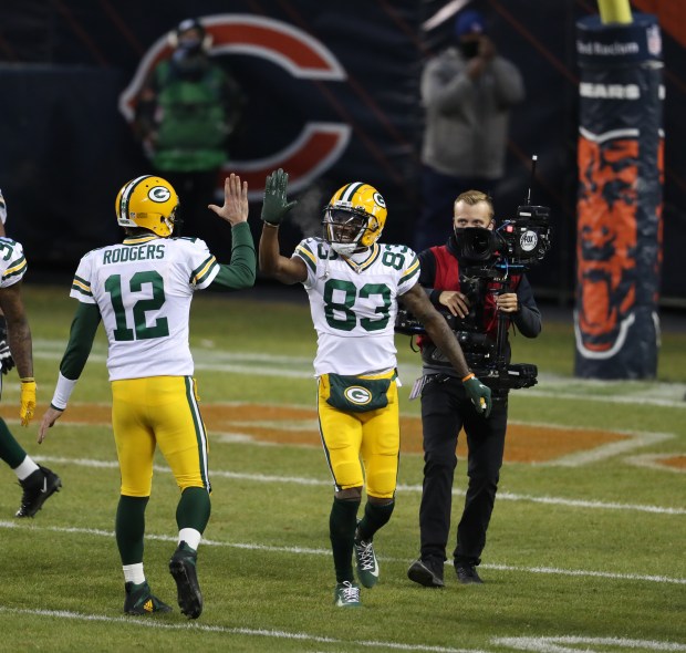 Green Bay Packers quarterback Aaron Rodgers (12) and wide receiver Marquez Valdes-Scantling (83) celebrate after the two connected on a long touchdown pass and catch in the second quarter of a game against the Chicago Bears at Soldier Field in Chicago on Jan. 3, 2021. (Chris Sweda/Chicago Tribune)