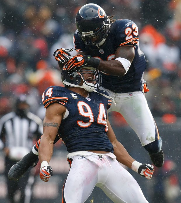 Devin Hester (23) celebrates with Chicago Bears teammate Brendon Ayanbedejo after a special teams stop in the first half during the Bears' 35-7 victory over the Green Bay Packers at Soldier Field in Chicago on Dec. 23, 2007. (Jim Prisching/Chicago Tribune)