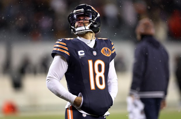 Chicago Bears quarterback Caleb Williams (18) stands on the field while warming up for the NFC wild-card game against the Green Bay Packers at Soldier Field in Chicago on Jan. 10, 2026. (Chris Sweda/Chicago Tribune)