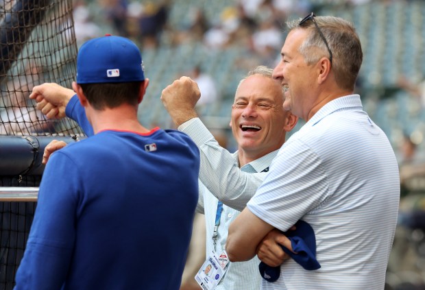 Chicago Cubs President Jed Hoyer, center, laughs with manager Craig Counsell and Cubs Chairman Tom Ricketts (right) before the NL Division Series Game 1 against the Milwaukee Brewers at American Family Field in Milwaukee on Oct. 4, 2025. (Chris Sweda/Chicago Tribune)