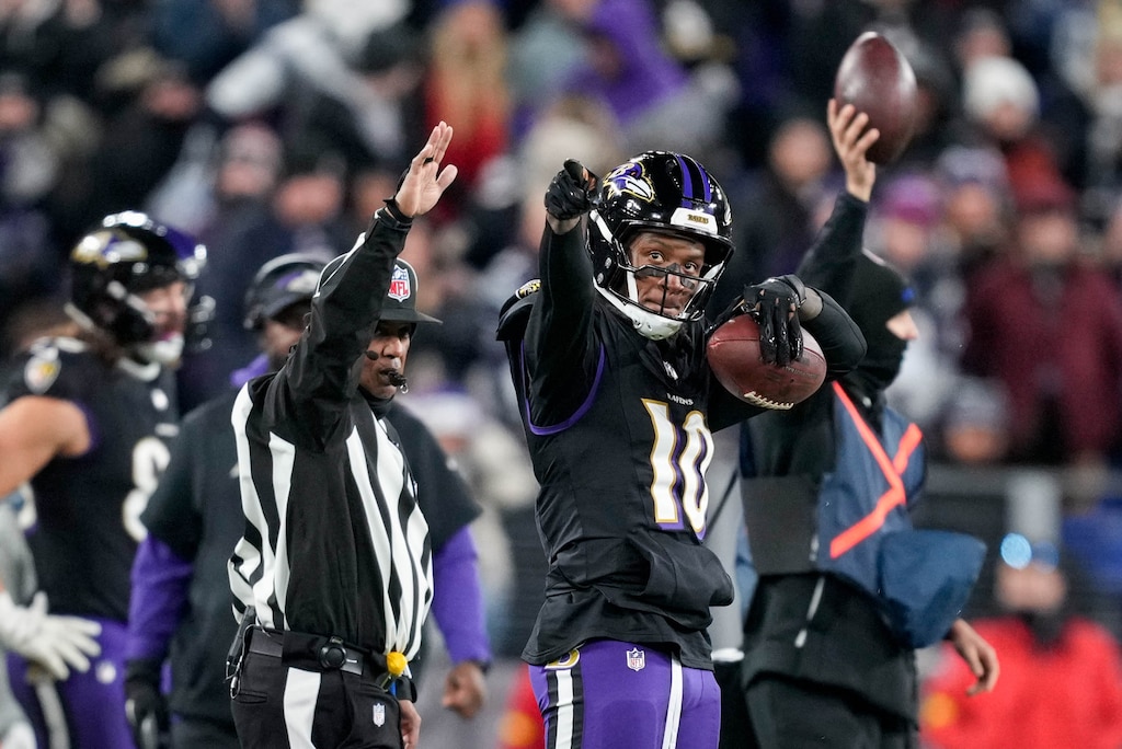 Baltimore Ravens wide receiver Deandre Hopkins (10) points downfield after catching a pass for a first down in the fourth quarter of a football game against the New England Patriots at M&T Bank Stadium in Baltimore, Md. on Sunday, December 21, 2025. The Sunday Night Football game was the Ravens’ final home game of the regular season.