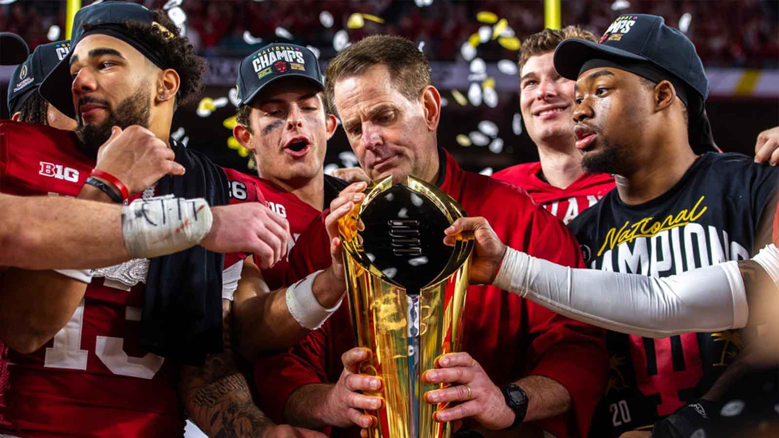 Indiana Head Coach Curt Cignetti prepares to lift the trophy on the podium after the College Football Playoff National Championship college football game at Hard Rock Stadium in Miami Gardens on Monday, Jan. 19, 2026.