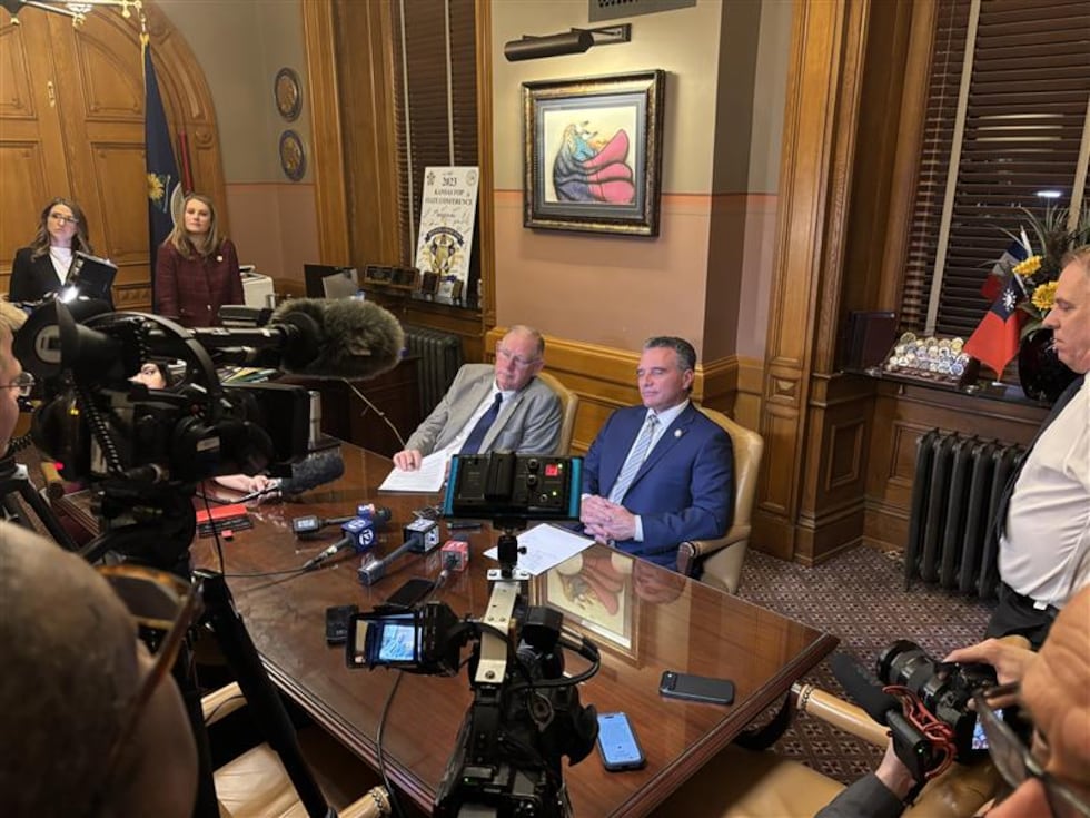 Speaker of the House Dan Hawkins and Senate President Ty Masterson taking questions from the...