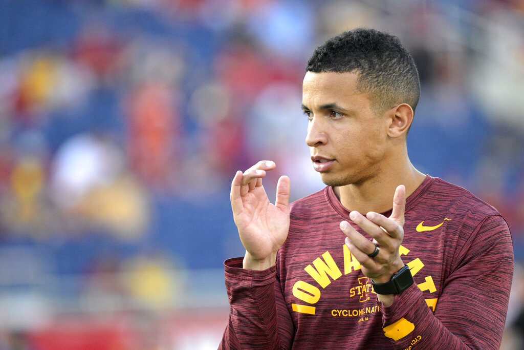 Iowa State running game coordinator Nate Scheelhaase watches players warm up before the Cheez-It Bowl NCAA college football game against Clemson, Wednesday, Dec. 29, 2021, in Orlando, Fla. 