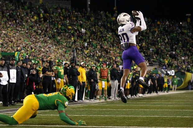 James Madison cornerback Justin Eaglin (30) intercepts a pass intended for for Oregon tight end Jamari Johnson (9) during the second half of the first round of the NCAA College Football Playoff, Saturday, Dec. 20, 2025, in Eugene, Ore. (AP Photo/Lydia Ely)
