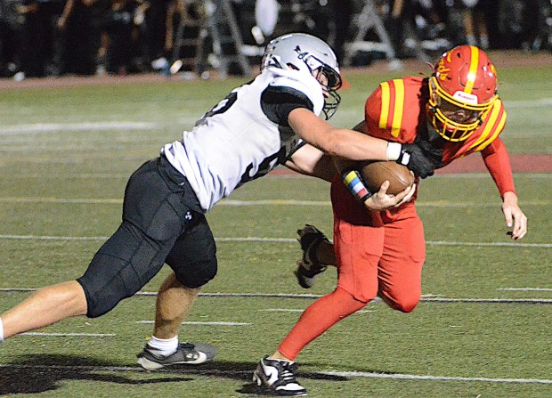 Strath Haven's Nick Farabaugh left, sacks Haverford quarterback Adam Kilpatrick in a September game. (PETE BANNAN/MediaNews Group) 