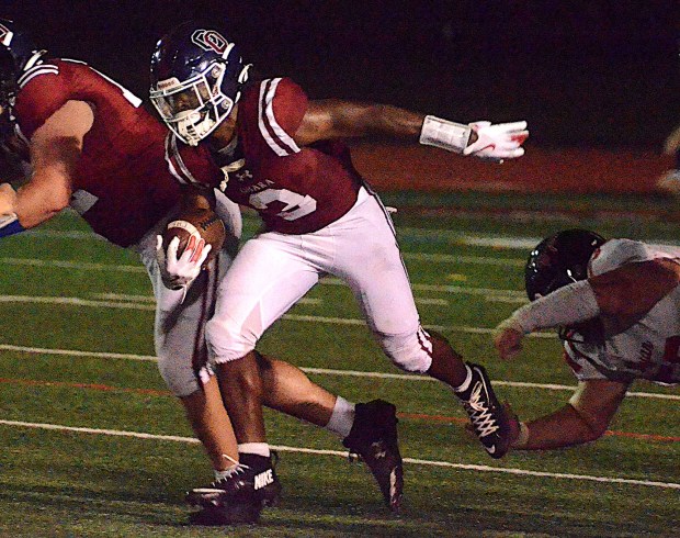 Cardinal O'Hara's Amahj Gowans runs the ball in a September game against Archbishop Ryan. (Pete Bannan/MediaNews Group)
